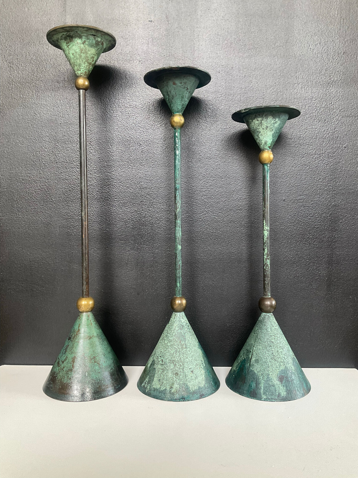 Postmodern metal candlestick trio