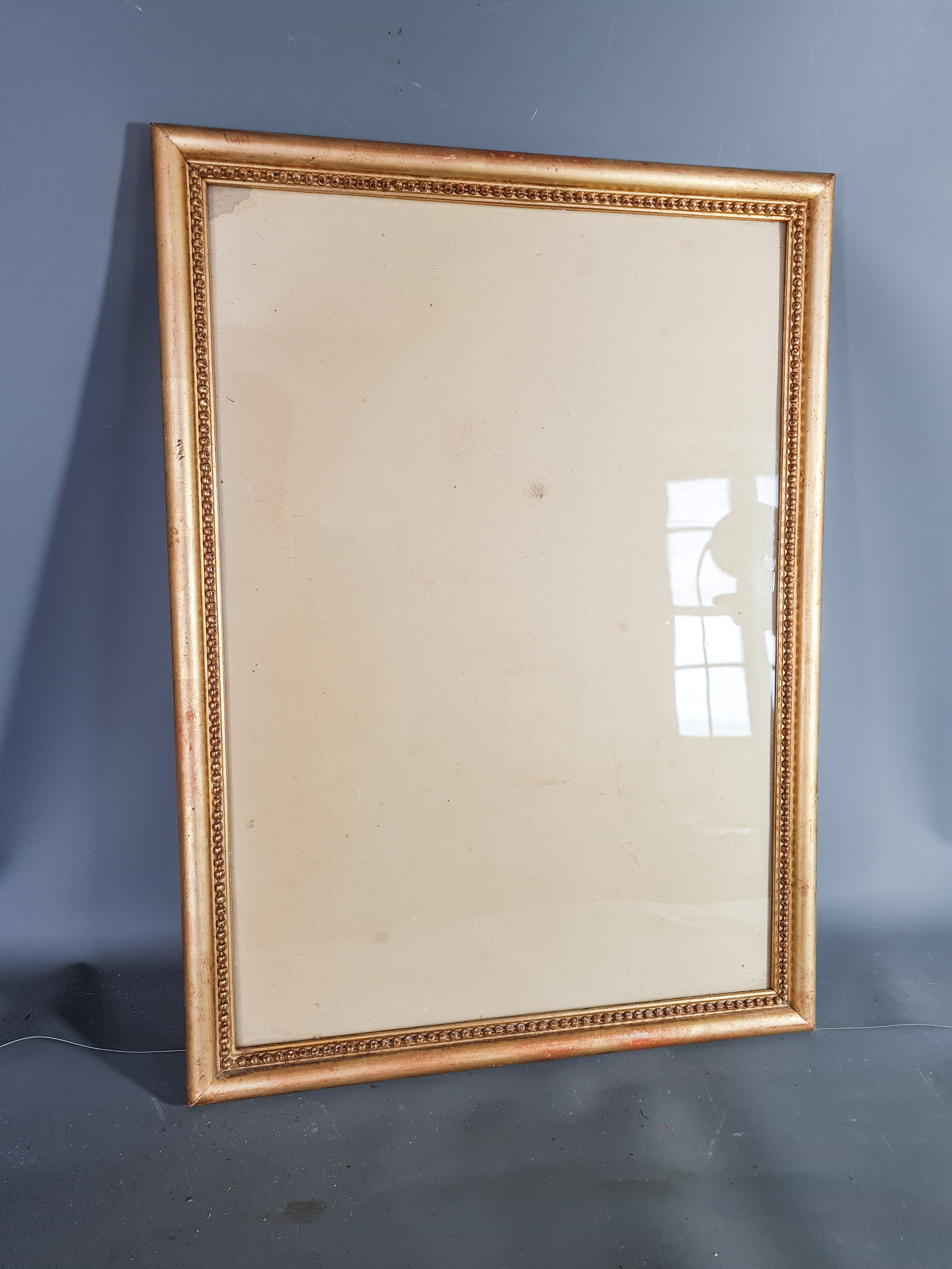 Old frame beaded decoration, gilded stucco wood