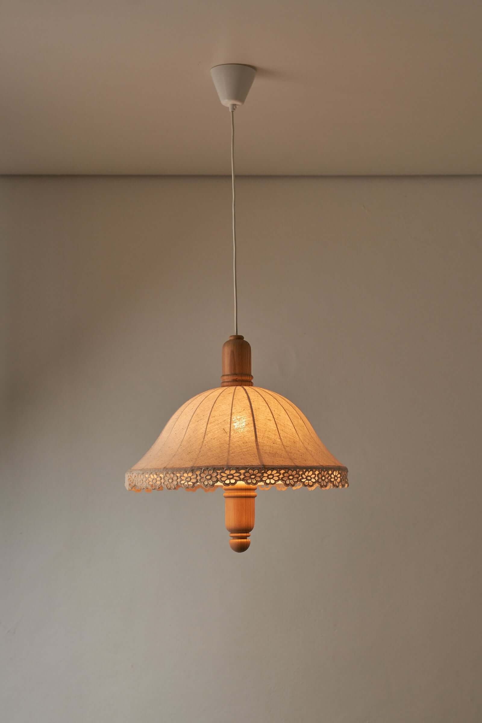 Wood and textile pendant from Sweden