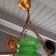 Old green opaline chandelier, gold metal and earthenware