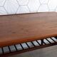Danish 1960s teak coffee table with slatted shelf.