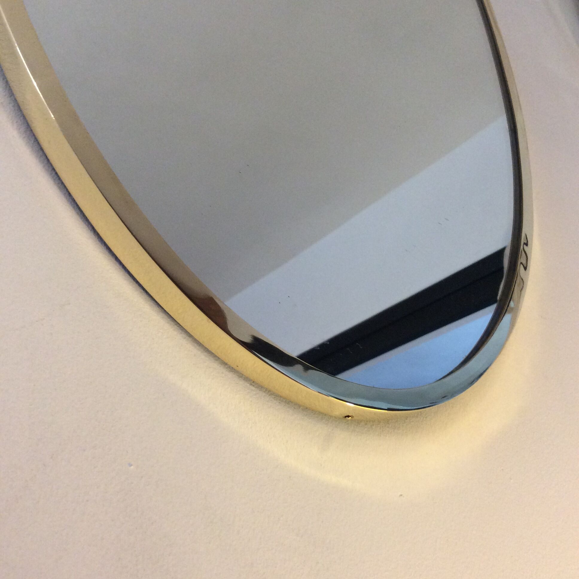 Belgo Chrom oval mirror from the 70s in solid brass
