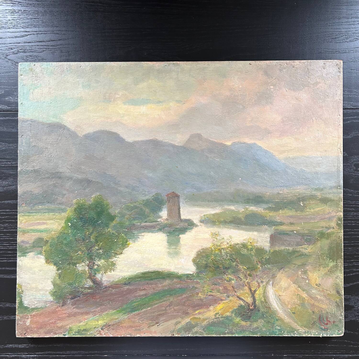 Antique painting of a lake and mountain landscape