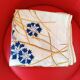 Square tablecloth. Hand-embroidered central crown; the blues.