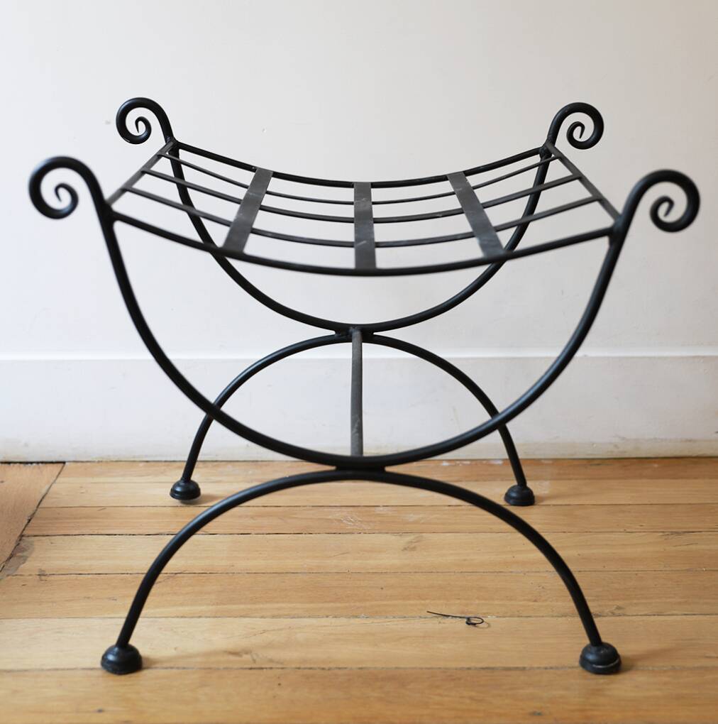 pair of wrought iron stools with cushions