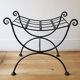 pair of wrought iron stools with cushions