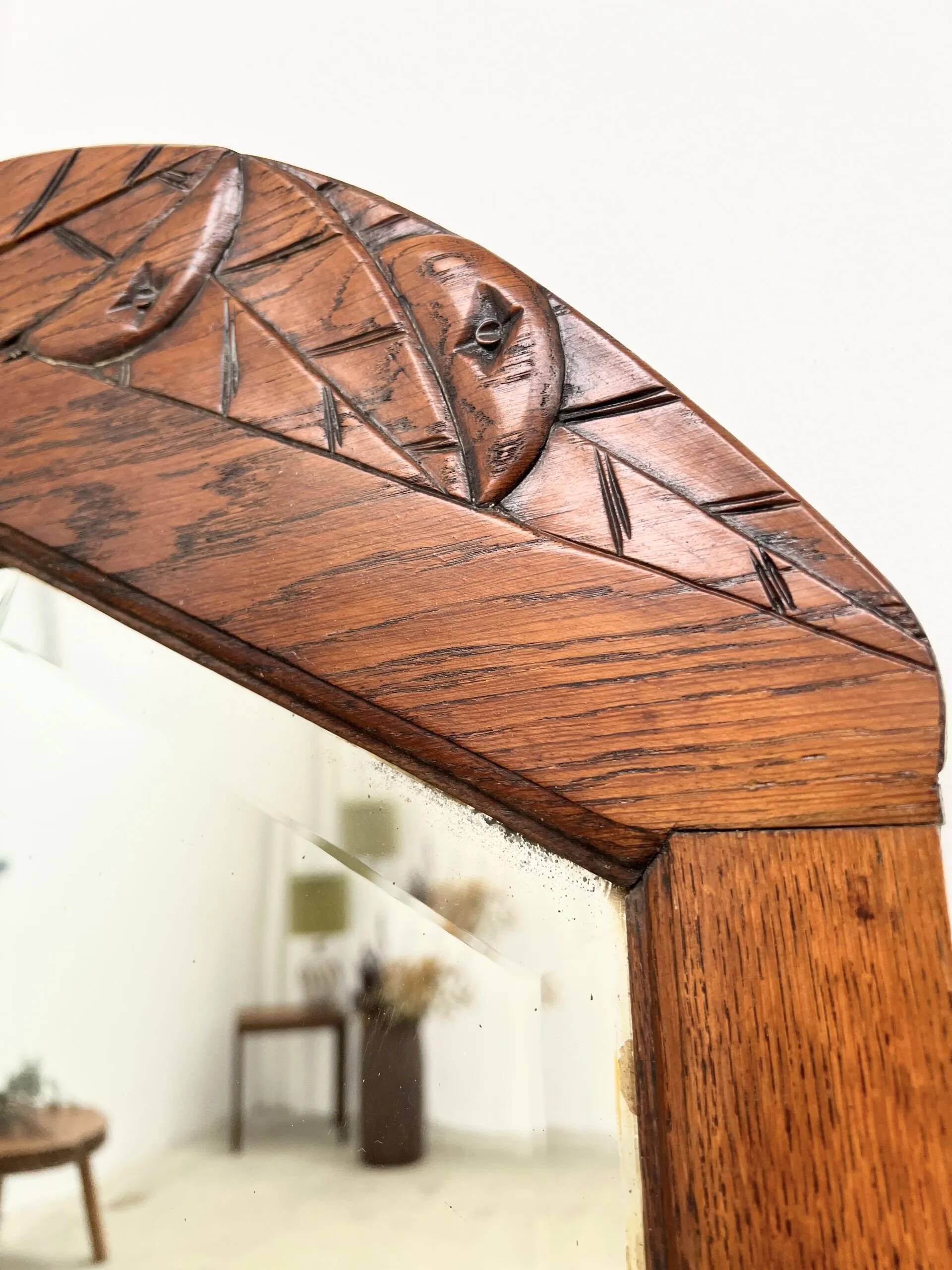 Art Deco oak mirror with carved motif
