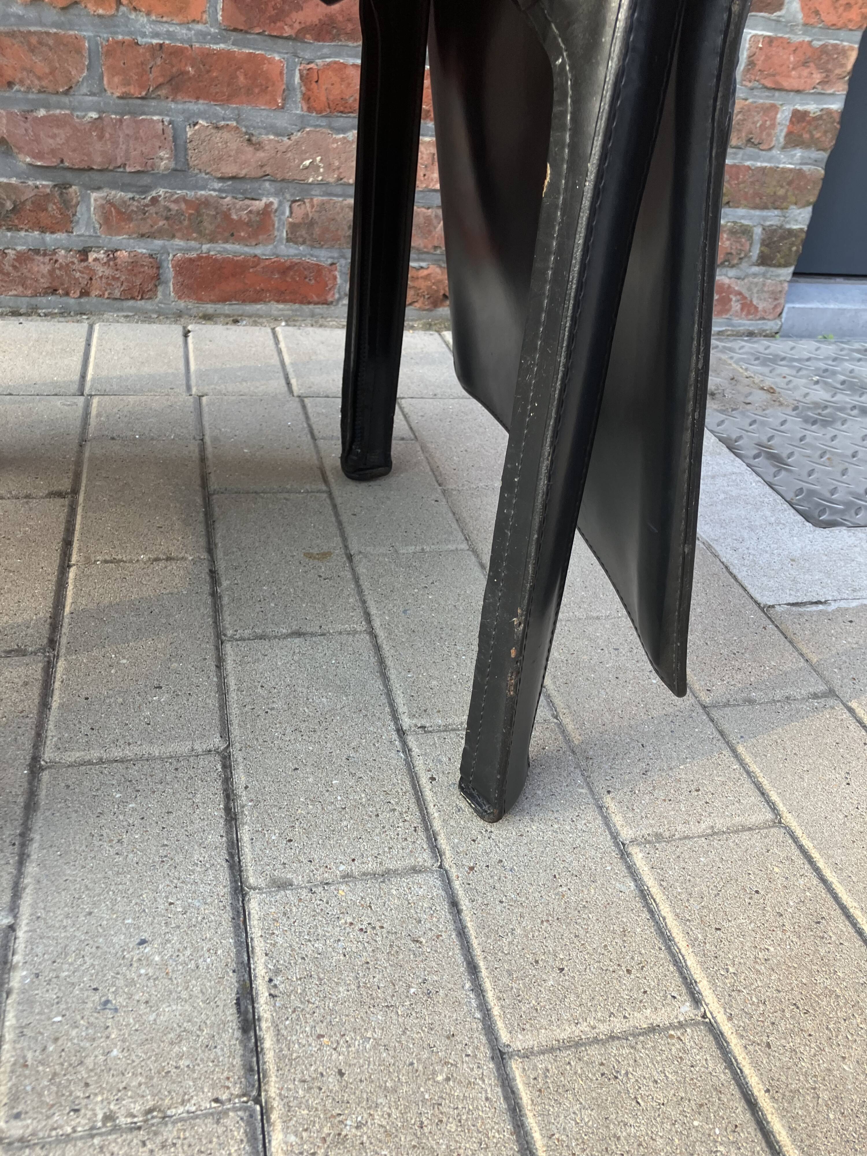 4 black Cassina Cab chairs by Mario Bellini