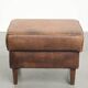 Set of a sheepskin armchair and ottoman finished with matching piping