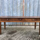 Antique chestnut farmhouse table with 3 drawers on the front.