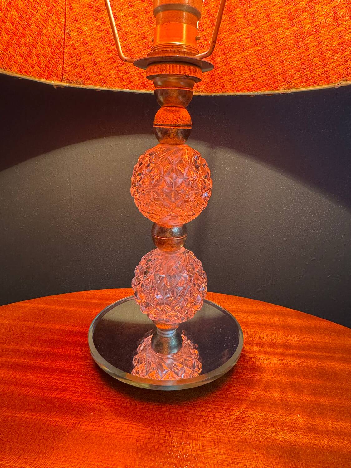 Small glass, mirror, and brass lamp from the 1960s.