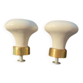 a pair of small antique porcelain and brass knob handles