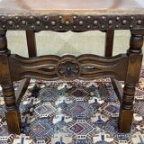 High-backed chair from the early 20th century in oak and leather