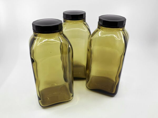 3 bouteilles de pharmacie en verre ambré moulé • bouchons bakélite • 1950