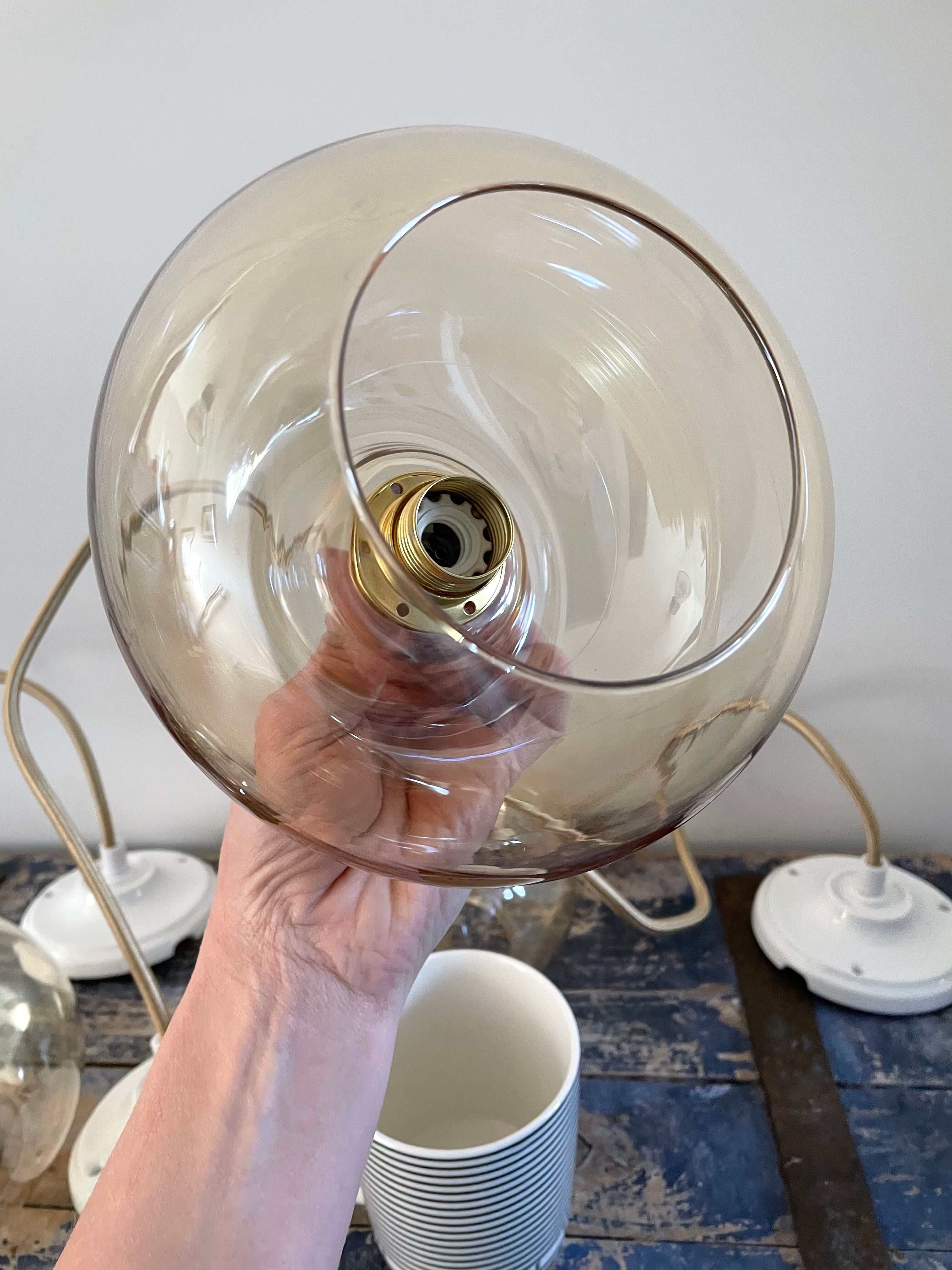 Set of three new electrified golden glass pendant lamps