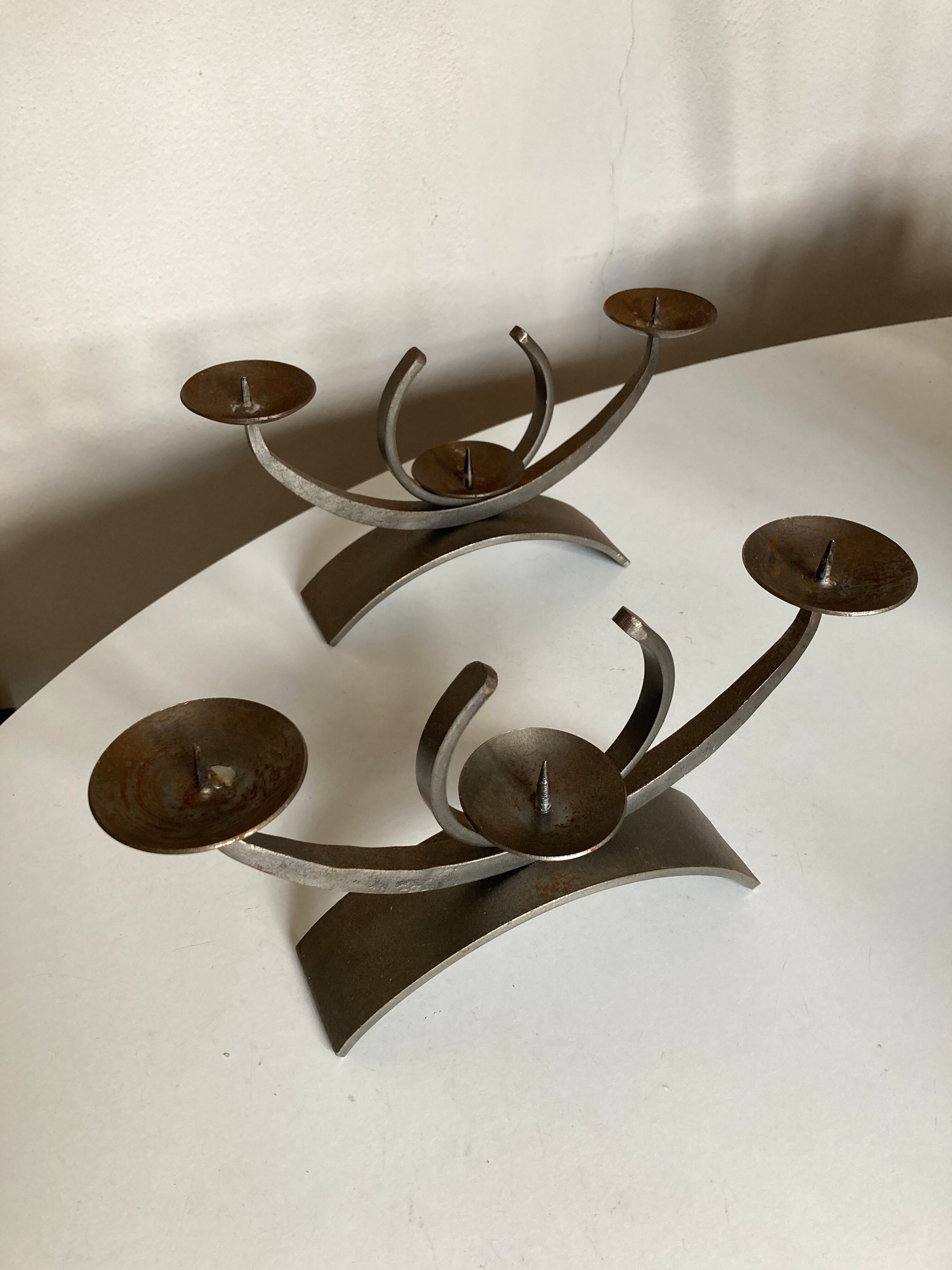 Pair of modernist candlesticks in beaten iron 1970
