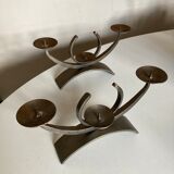 Pair of modernist candlesticks in beaten iron 1970