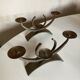 Pair of modernist candlesticks in beaten iron 1970