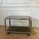 Rolling serving cart in chromed steel and smoked glass, 70s design