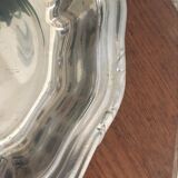 Two matching round dishes in stainless steel