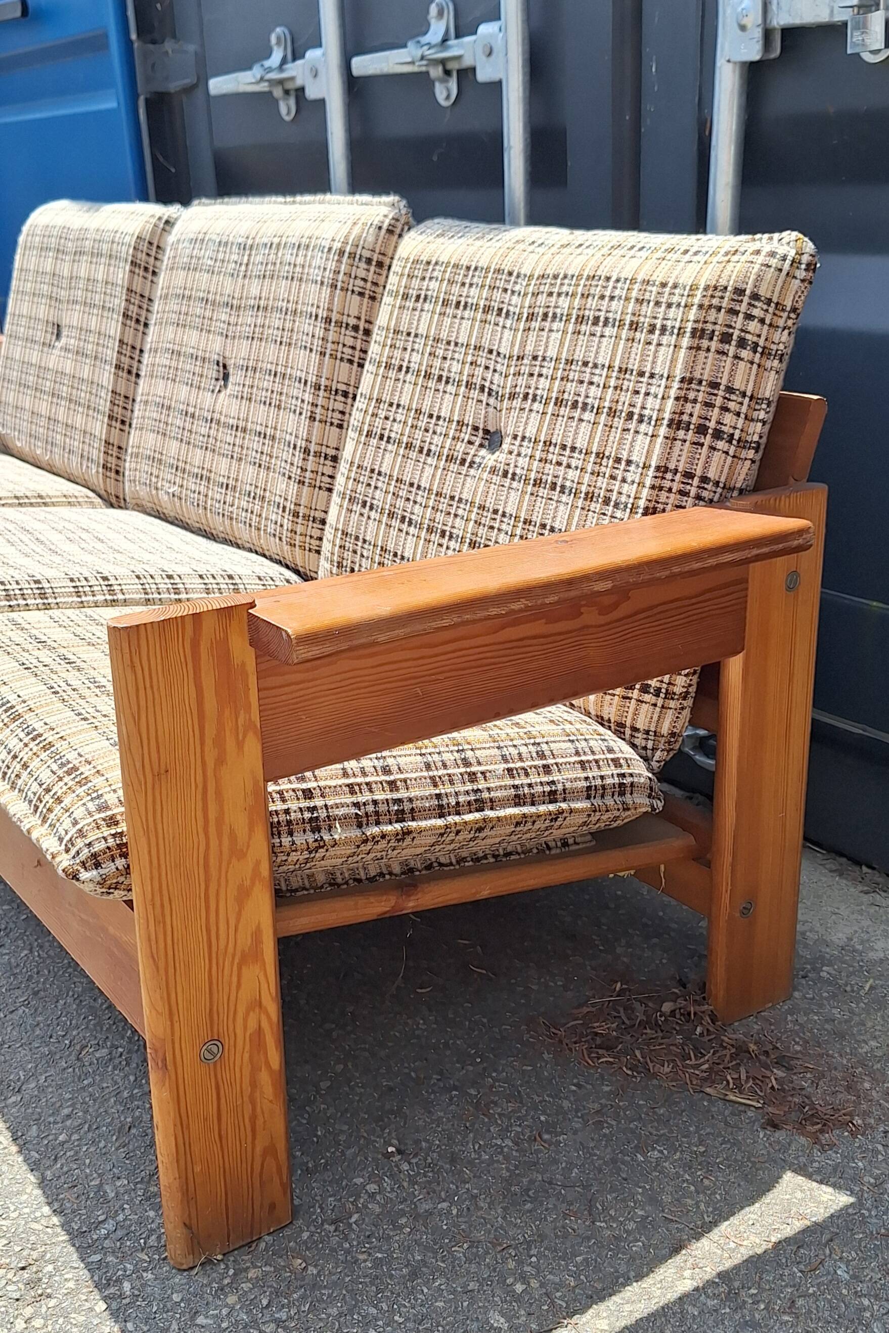 Brutalist-style bench and armchairs in 1970s pine.