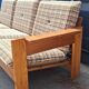 Brutalist-style bench and armchairs in 1970s pine.