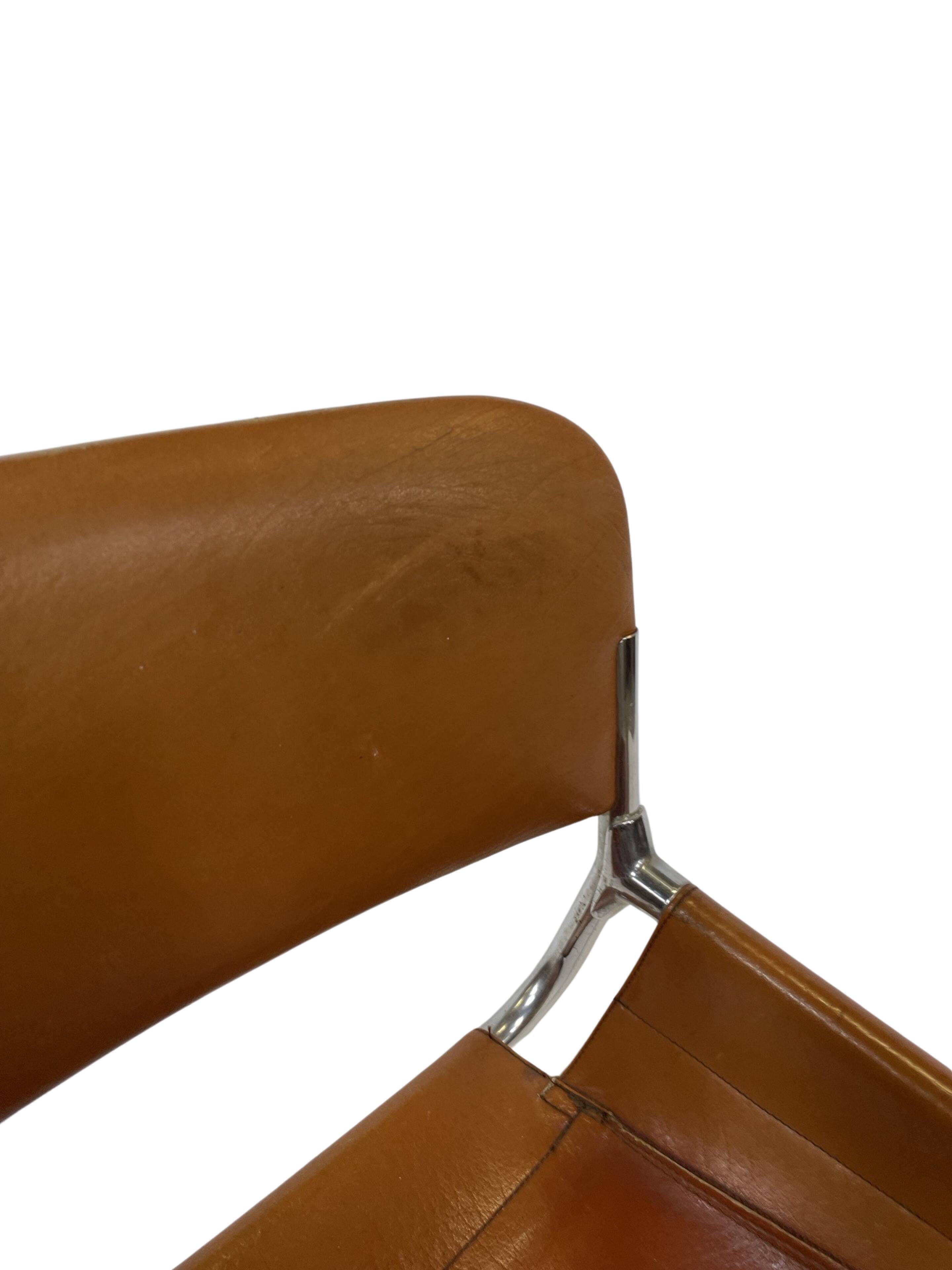 vintage dining room chair in cognac leather and chrome 1970s Italy