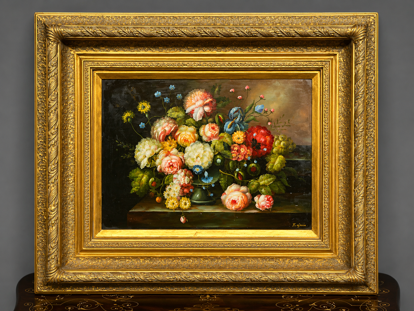 Still life with roses in a beautiful frame on a wooden panel in Flemish style.