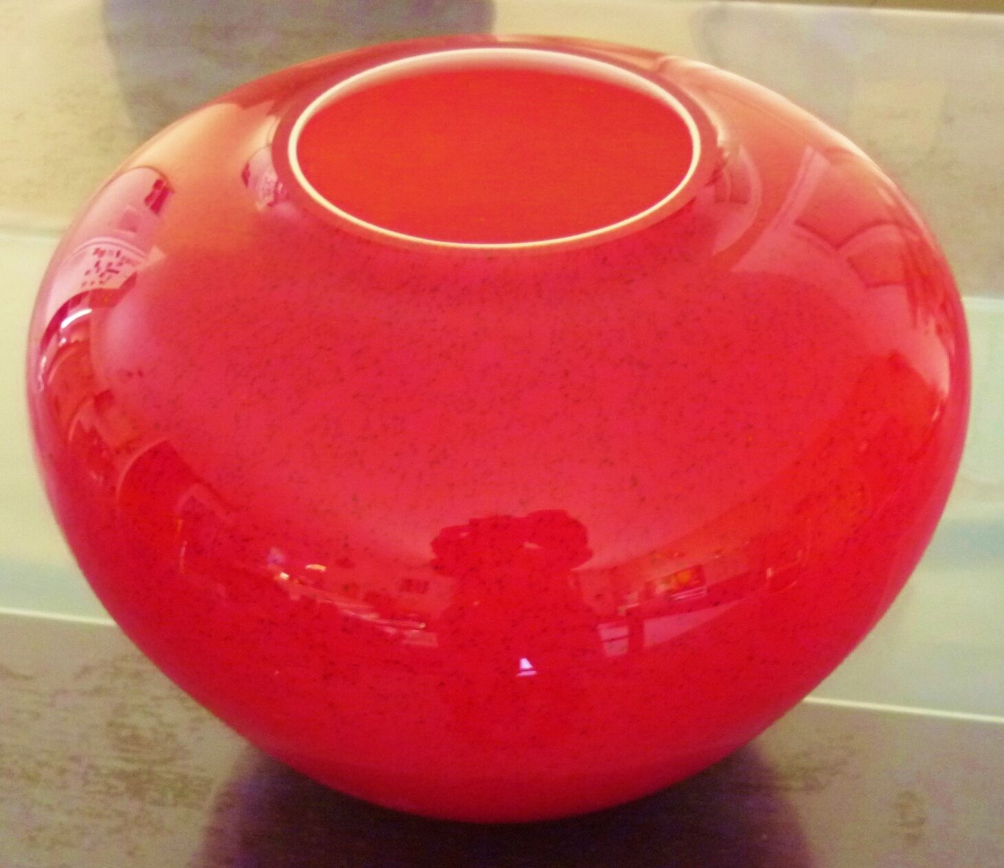 Pot-bellied, art deco vase in speckled ruby red multi-layered glass, white interior