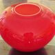 Pot-bellied, art deco vase in speckled ruby red multi-layered glass, white interior