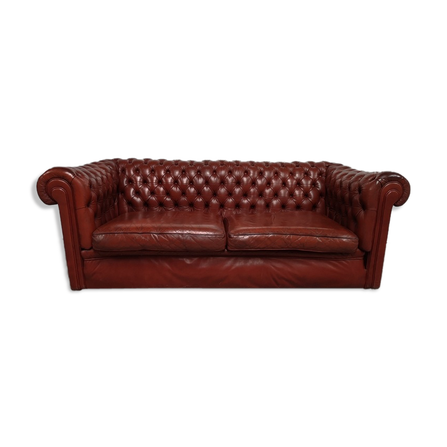 Old red leather Chesterfield sofa