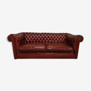 Old red leather Chesterfield sofa
