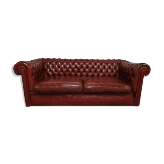 Old red leather Chesterfield sofa