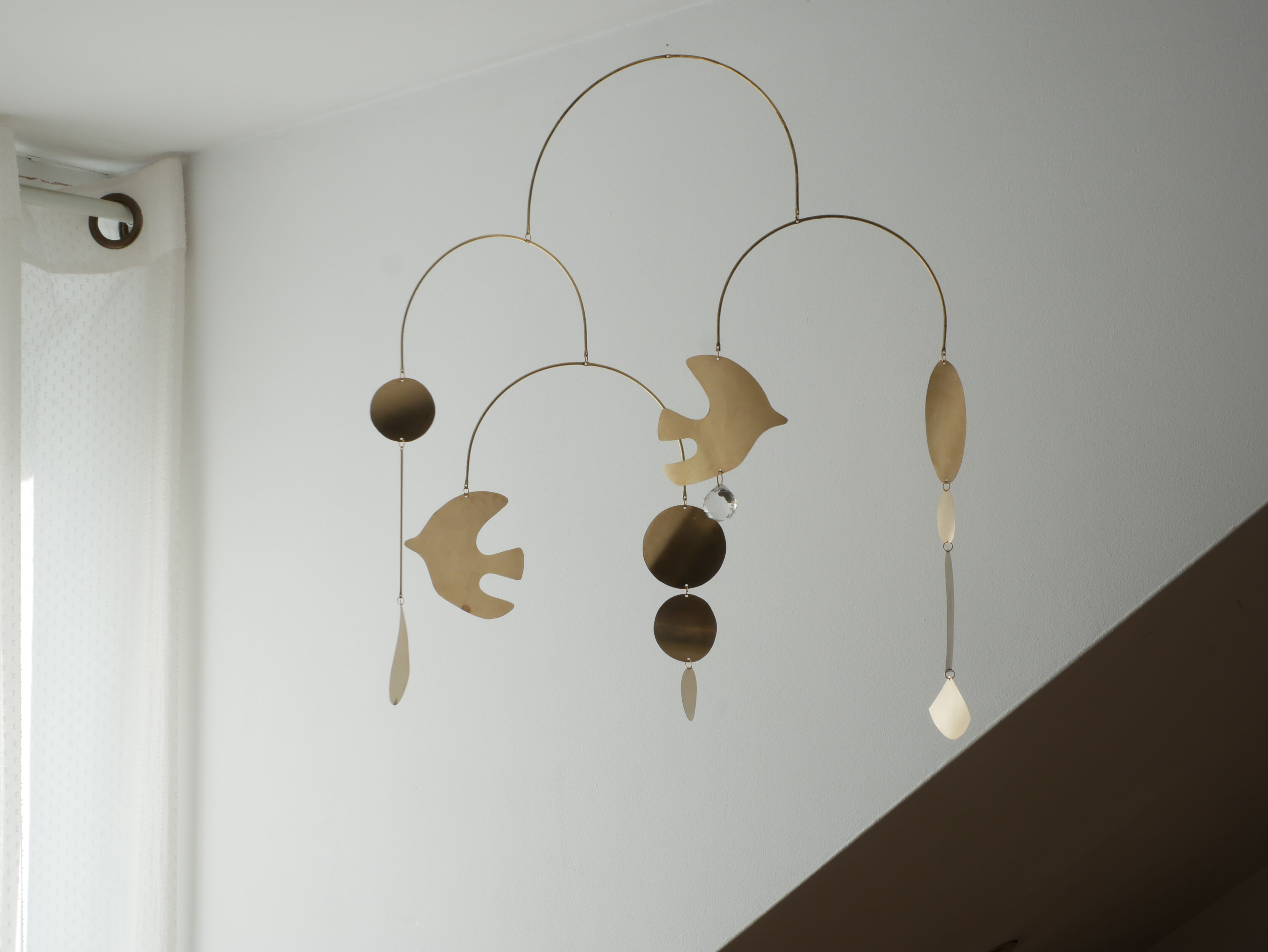 Mobile model Rana . Mobile in abstract brass.