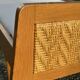 Read a vintage wooden and cane bed, with compass legs – mattress 80 × 190 cm.