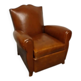 Antique club chair with mustache back