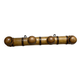 Antique wall-mounted coat rack in turned bamboo-style wood
