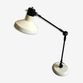 Desk lamp has two articulated metal arms
