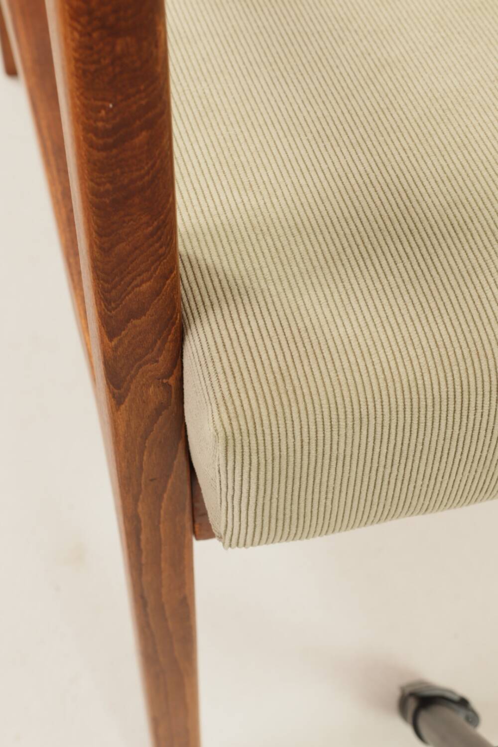 Vintage armchair in olive corduroy with a wooden frame.