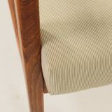 Vintage armchair in olive corduroy with a wooden frame.