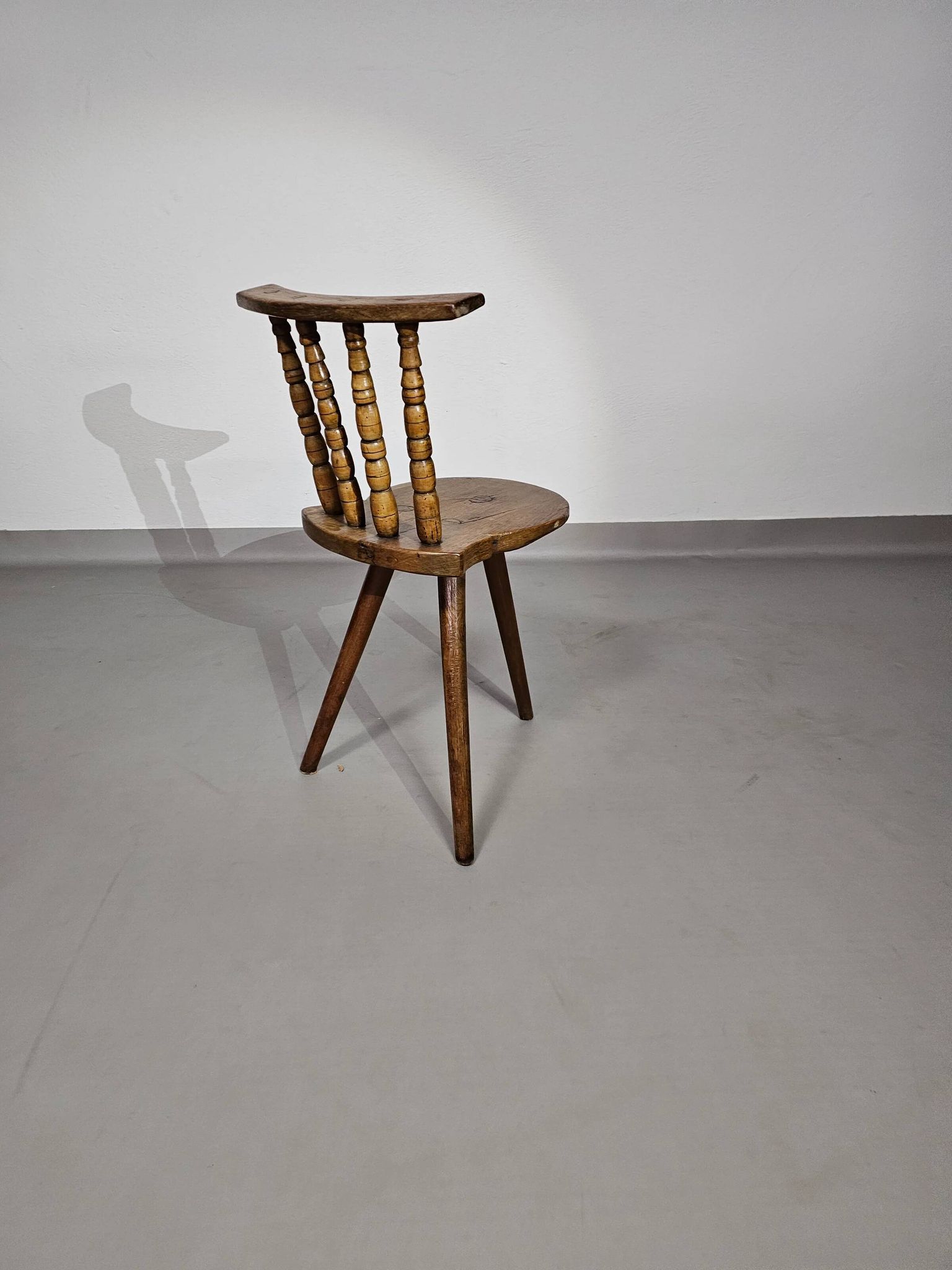 Old farmers tripod chair for decorative use