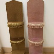Two very kitsch wall shelves in bronze and pink velvet