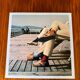 ⸻  Vintage Color Photograph from 1973 – Shoes on Wooden Deck