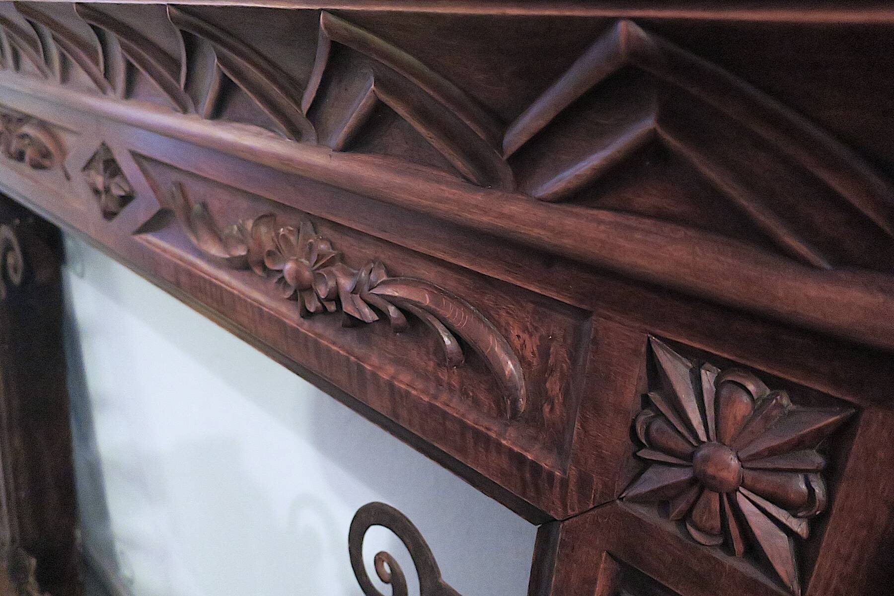 Art deco fireplace in carved solid teak and wrought iron, 1920