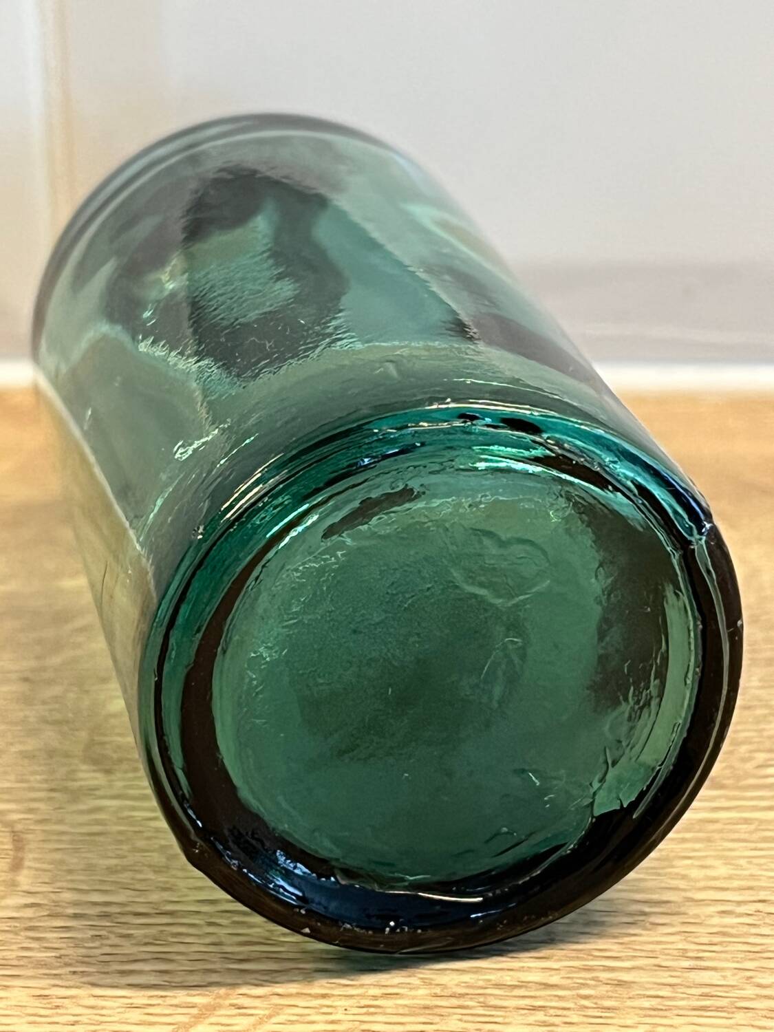 Small vintage dark turquoise blue bottle