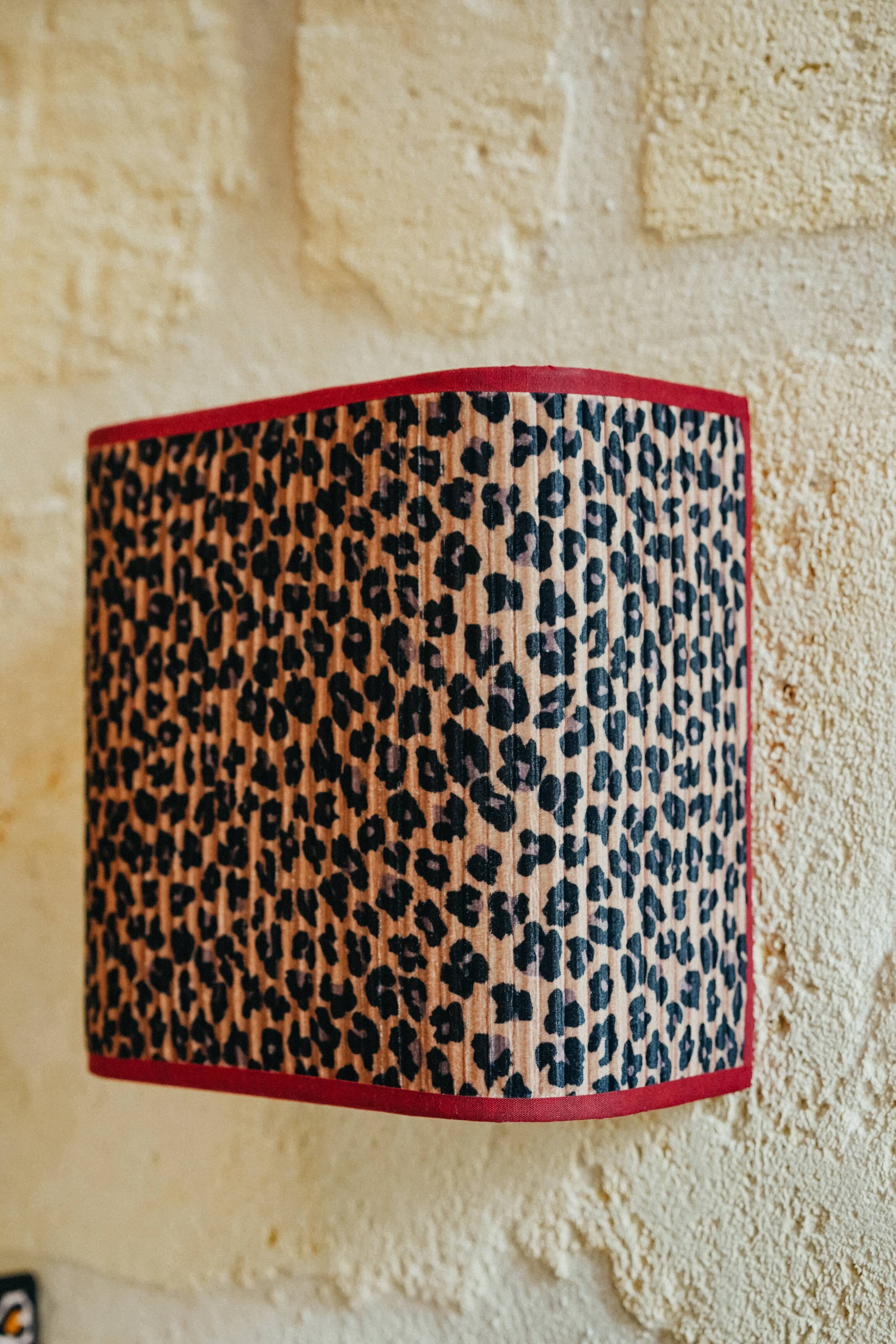 La divine – pleated leopard applique.