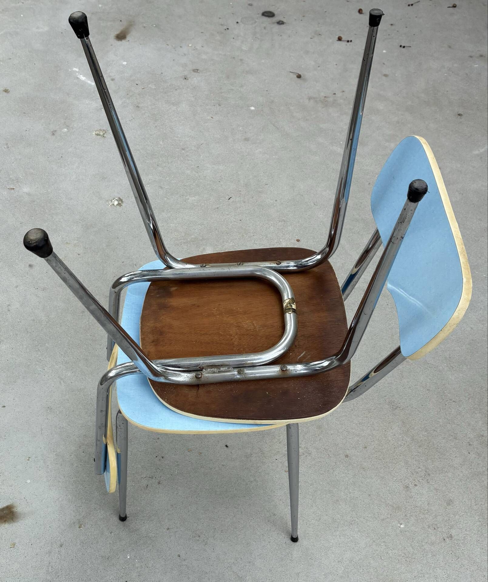 Two blue Formica "Peugeot" chairs.