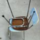 Two blue Formica "Peugeot" chairs.