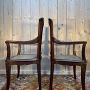 Pair of wide caned armchairs from the Art Nouveau period.