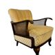 Vintage wooden armchair with rattan weaving.